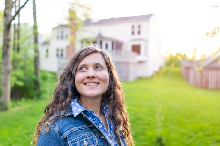 woman in front of home