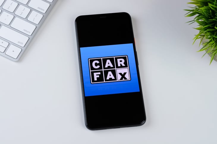 CARFAX app logo on a smartphone screen