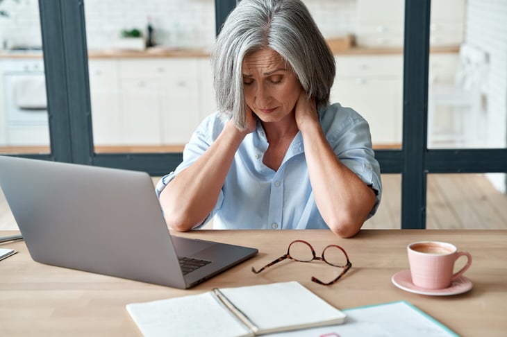 Upset older woman in pain