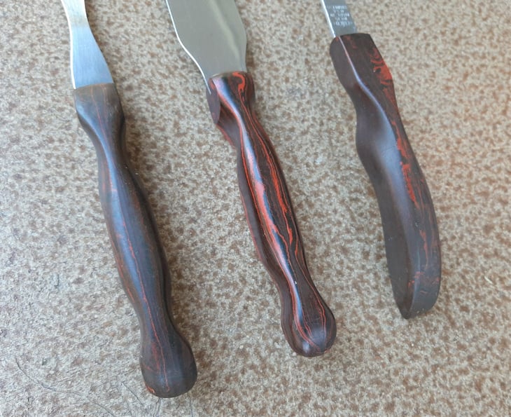 Cutco cooking utensils with brown swirl handles