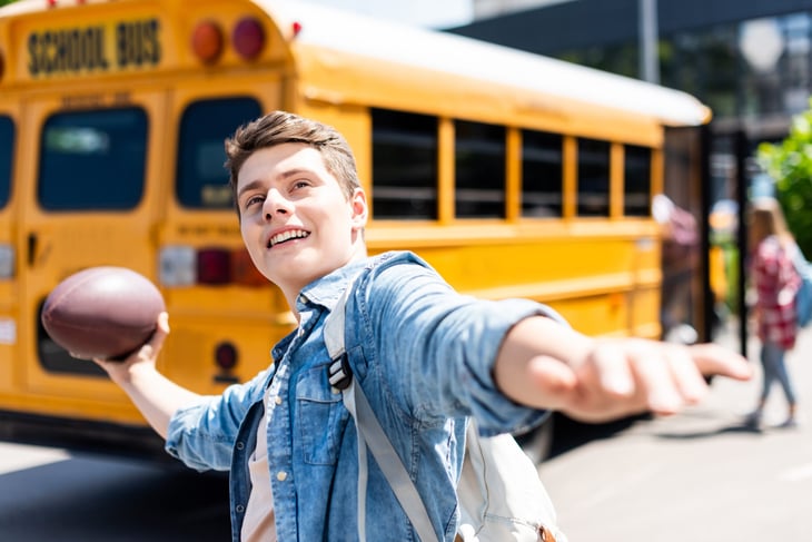 Teen throwing a football