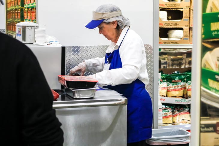 A woman providing food samples Costco