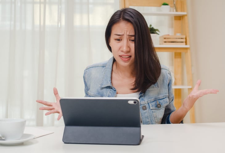 Upset woman on a tablet computer
