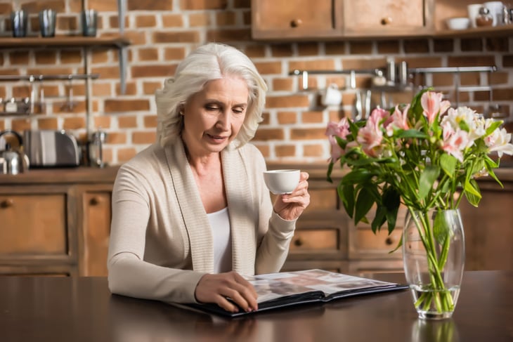 Woman looking at a photo album