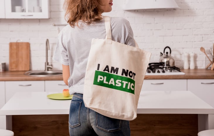 Woman carrying a reusable shopping bag