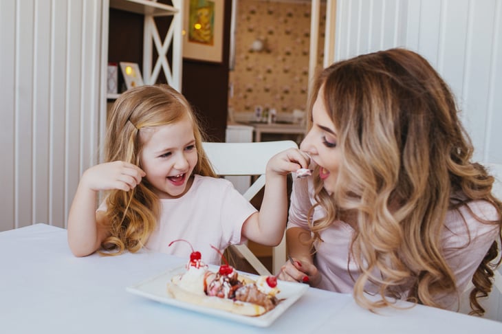 Mother and daughter eating ice cream