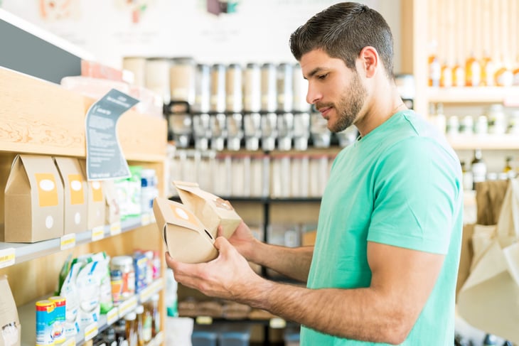 Shopper comparing products at the grocery store