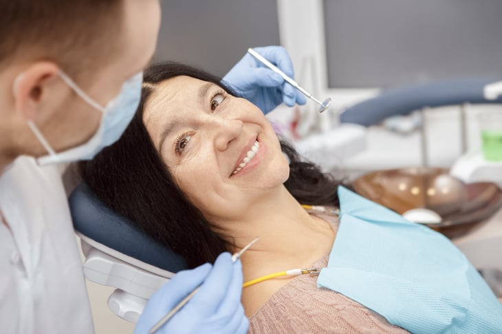 Older woman smiling at the dentist