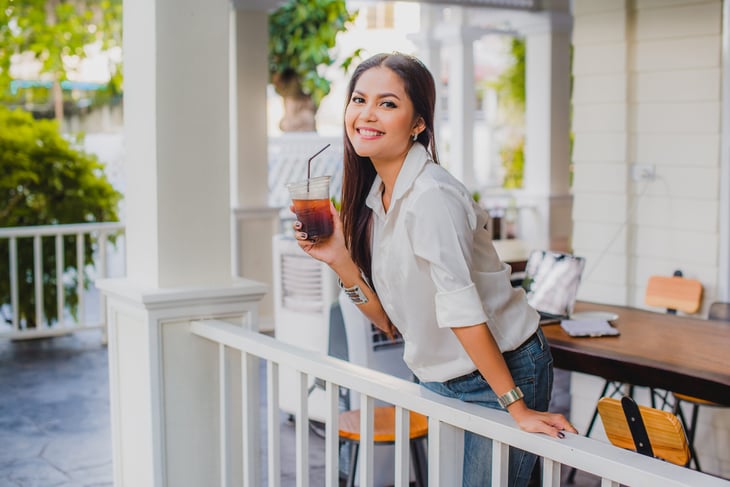 Woman drinking iced coffee