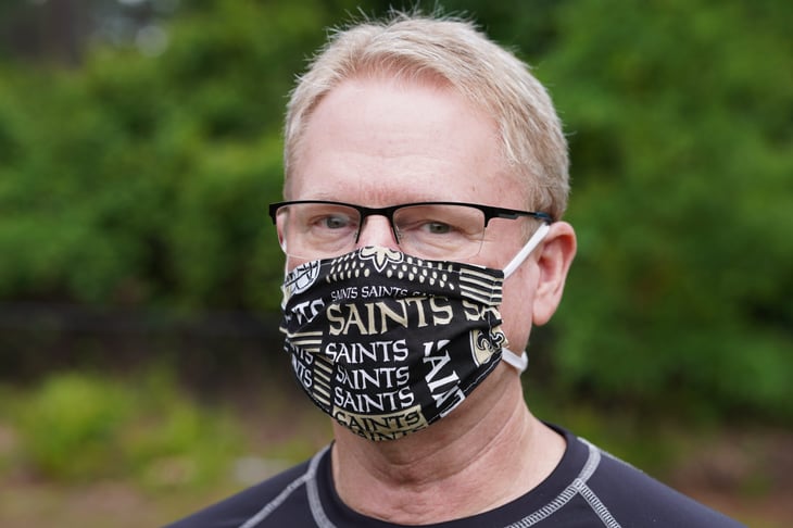 Man in a New Orleans Saints mask