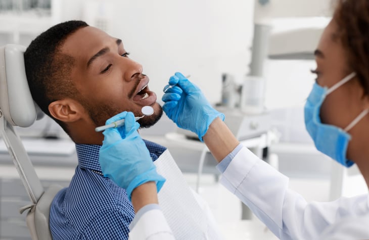 Dentist with patient