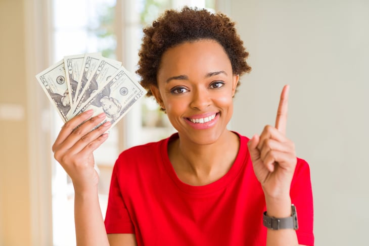 Woman holding money