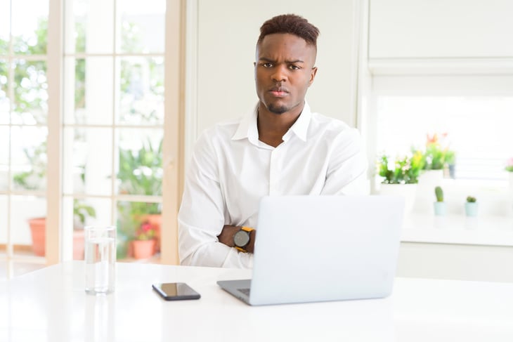 Unhappy man on laptop