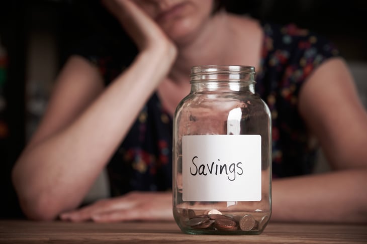 Sad woman with little savings