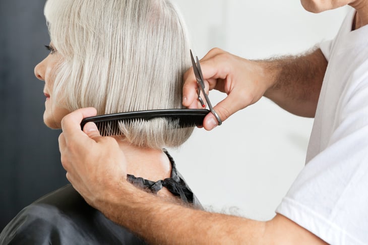 Older woman getting a haircut