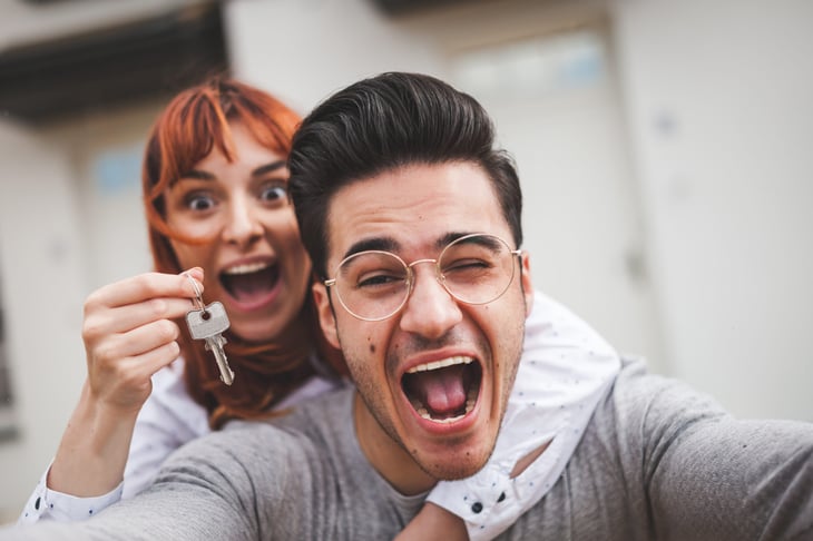 Excited couple moving into a new home