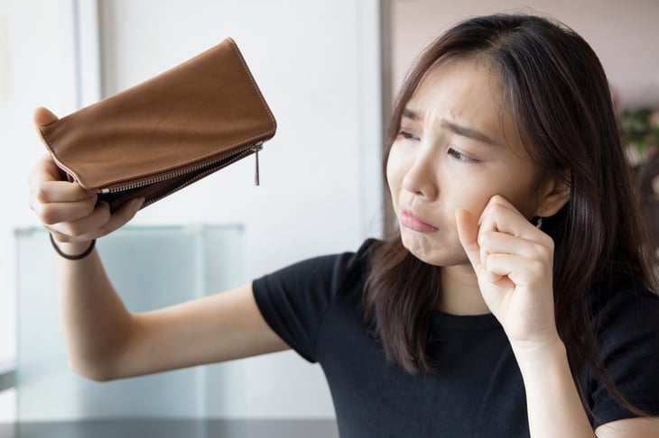 Woman with empty wallet