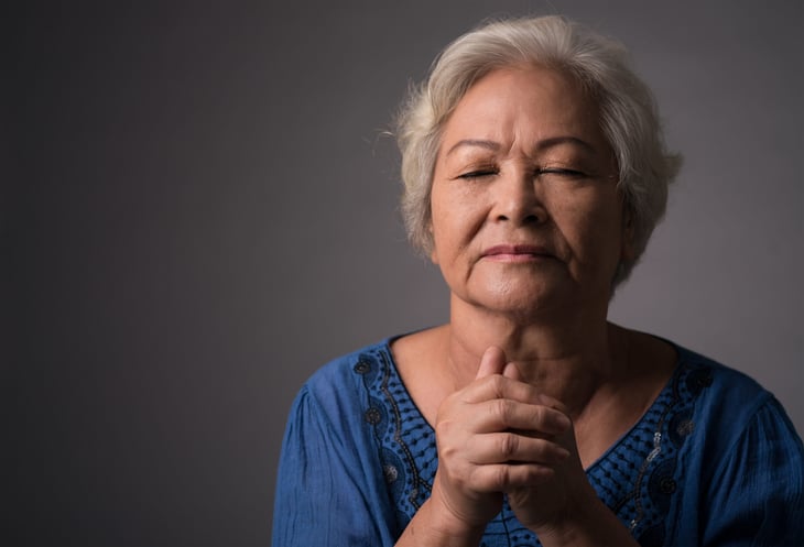Senior woman praying