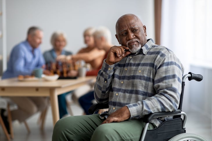 senior man in wheelchair feeling lonely