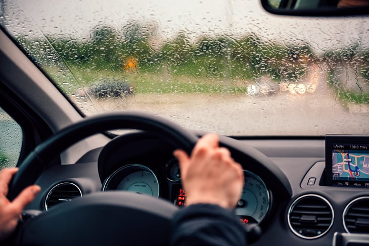 Woman driving in the rain