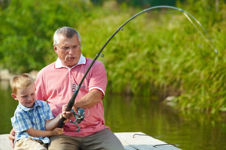 Grandfather and grandson fishing