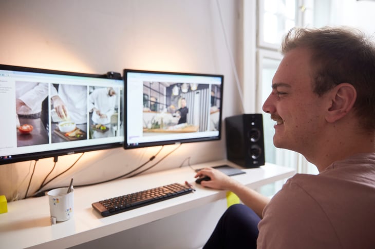 Man using two computer monitors