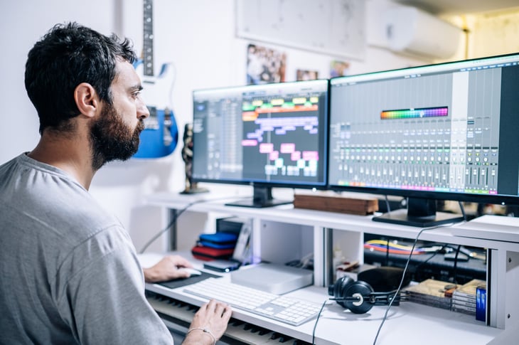 Man producing music on his computer