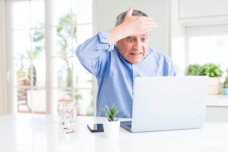 older man upset and shocked by what he sees on computer