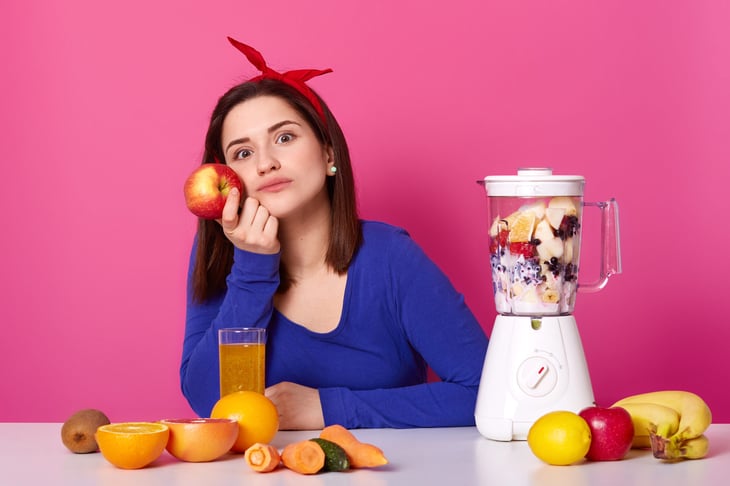 Woman with a juicer