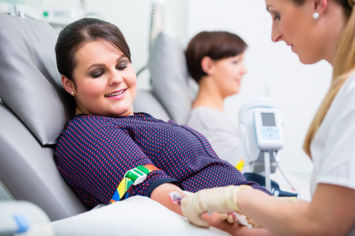 Woman giving blood