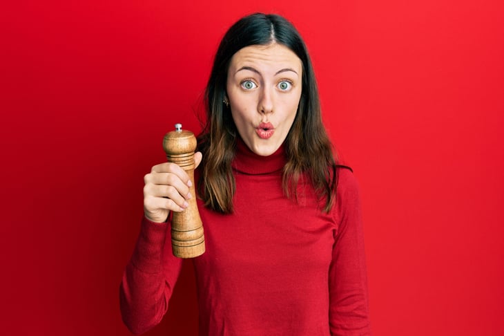 Woman with pepper grinder