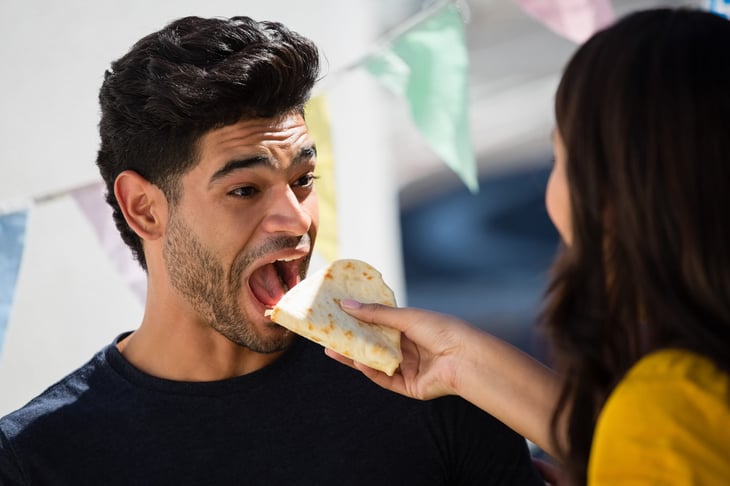 Man eating a taco