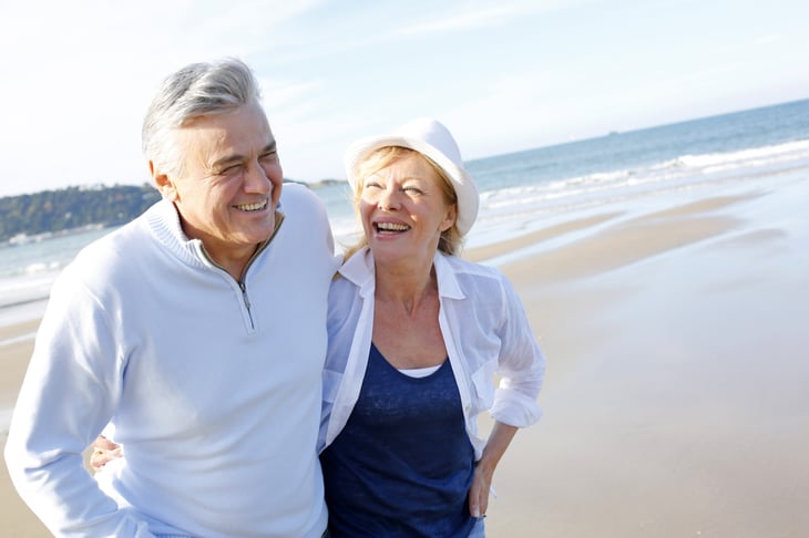 Happy retirees on beach