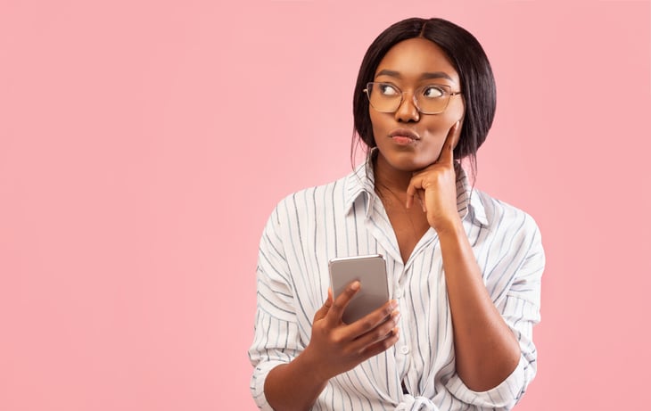 Woman thinking about her phone plan