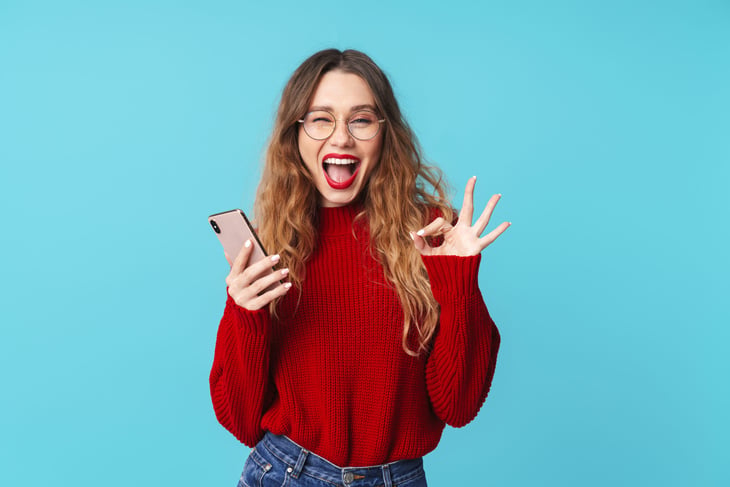 Excited woman happy with her new phone plan
