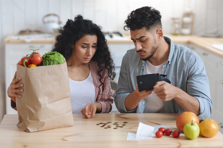 Upset couple worried about grocery shopping costs