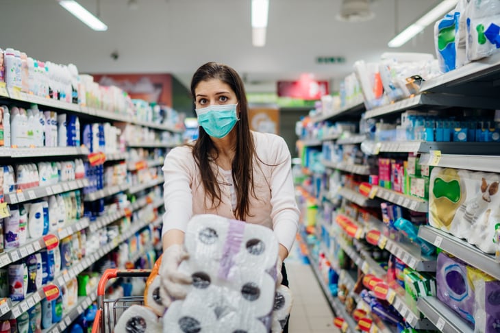 Woman buying toilet paper in bulk