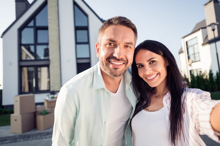 Happy couple buying a house