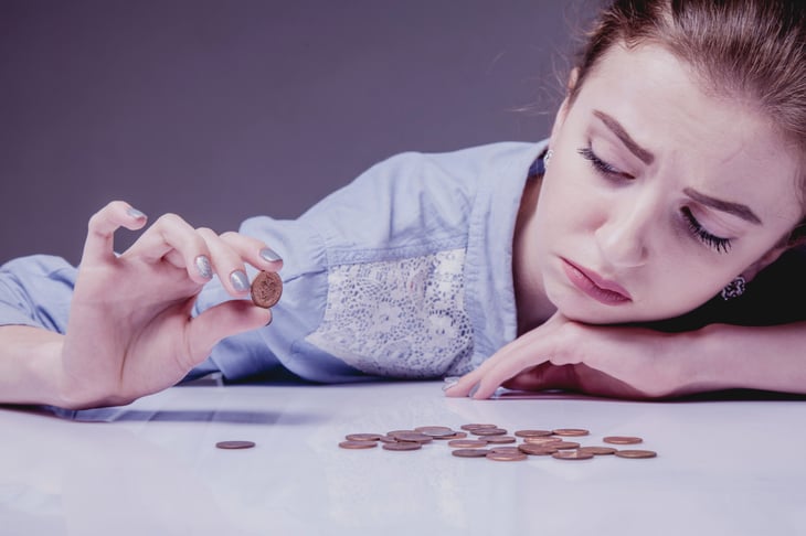 Woman struggling to save money