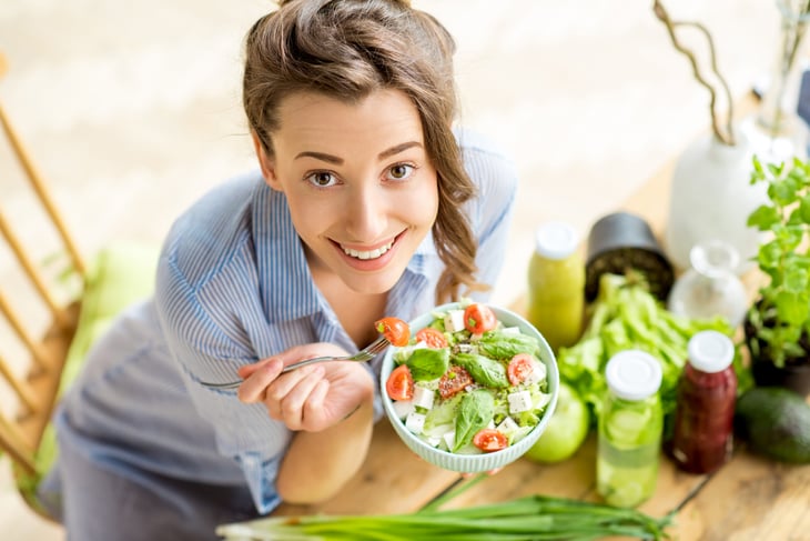 Woman eating salad