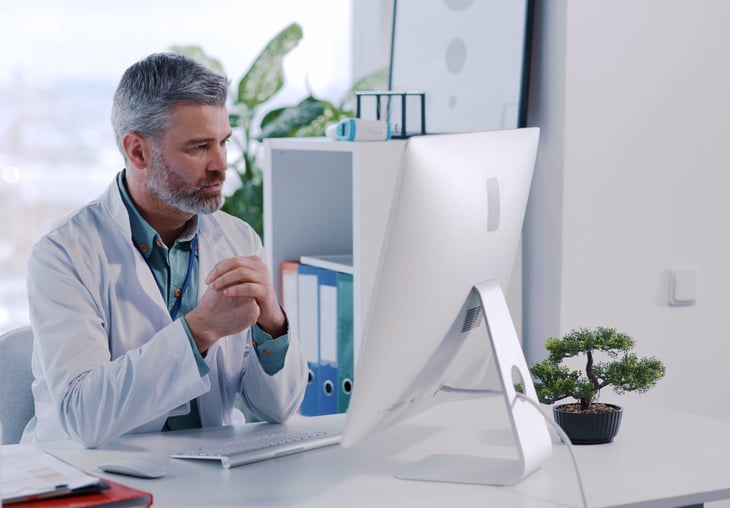 Doctor talking to a patient via telehealth video call