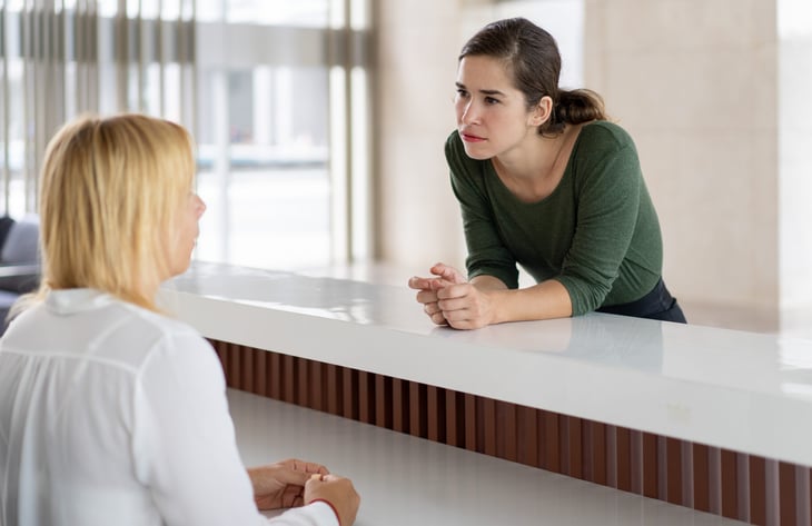 Woman trying to cancel hotel reservation