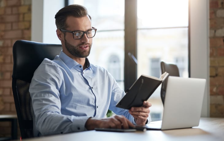 Businessman studying technology jobs