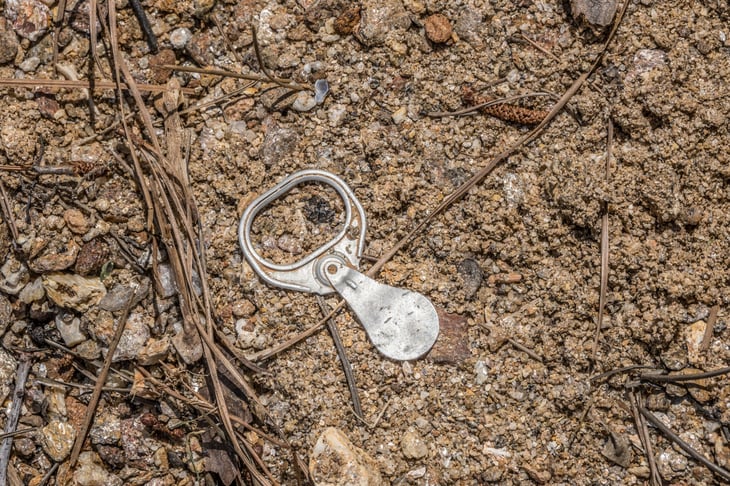 Pop top, or pull tab, litter from a soda can