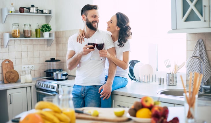 happy couple in stylish kitchen