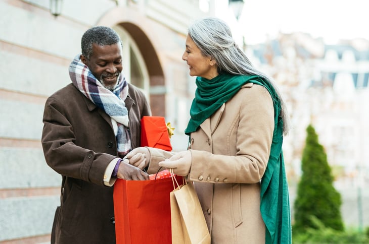 Older couple shopping in cold weather