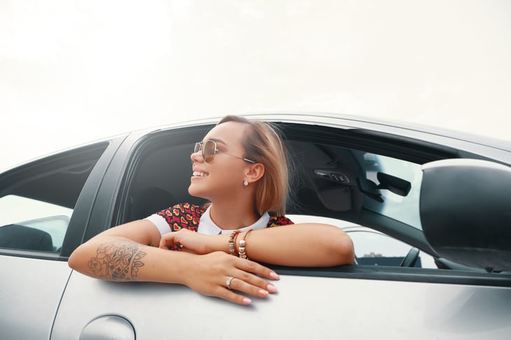 Happy driver in silver car
