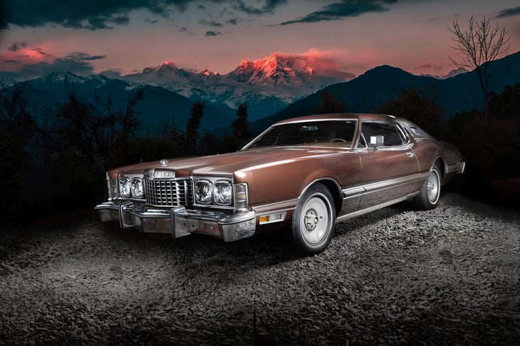 Retro muscle car on the mountains background. Vintage car. Old mobile outdoor. Ford Thunderbird "Big Birds" 1976, front view. Colorado, United States. April 13. 2021