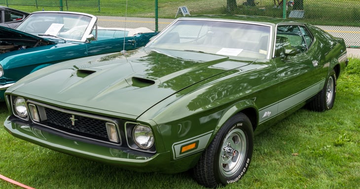 Pittsburgh, Pennsylvania, USA July 24, 2021 The Pittsburgh Vintage Gran Prix in Schenley Park, a yearly event since 1983 featuring car shows and circuit races. A 1973 green Mustang Mach 1 on display