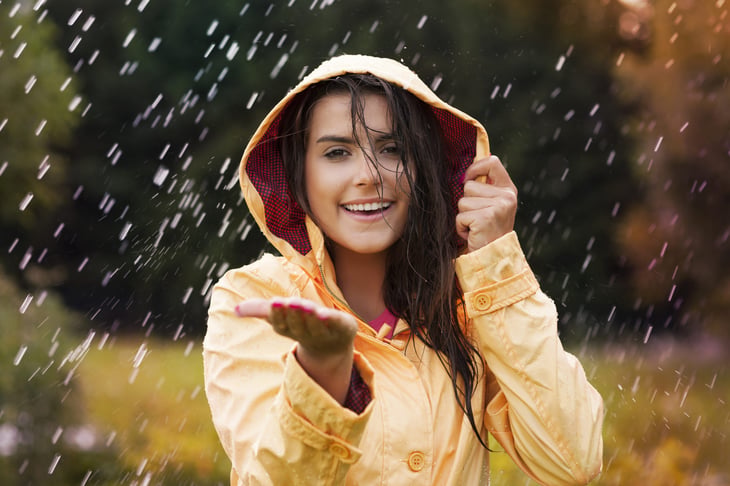 Woman standing in the rain